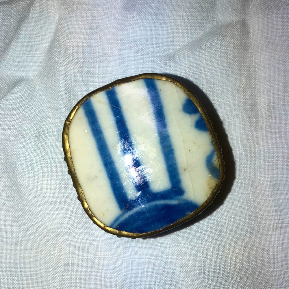 Simple silver box with blue design on top